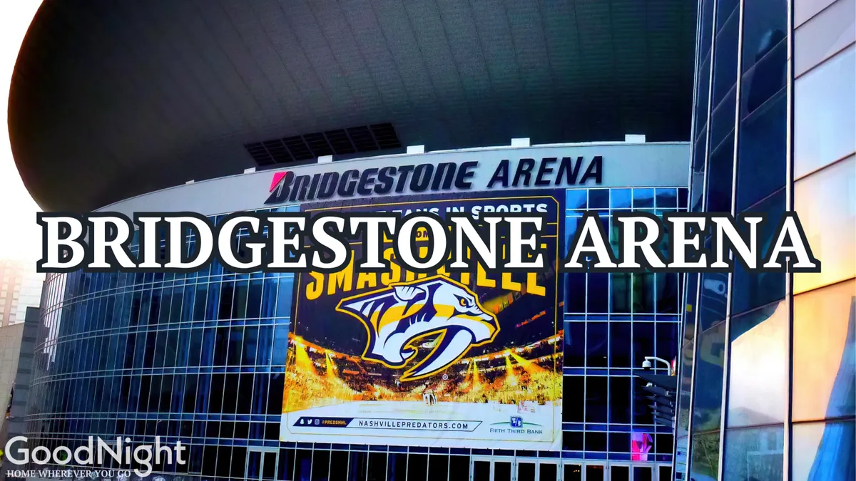 This exterior image prominently features the Bridgestone Arena signage and a large promotional banner for the Nashville Predators. The arena's modern facade buzzes with anticipation, suggesting a major city venue just minutes from the property.